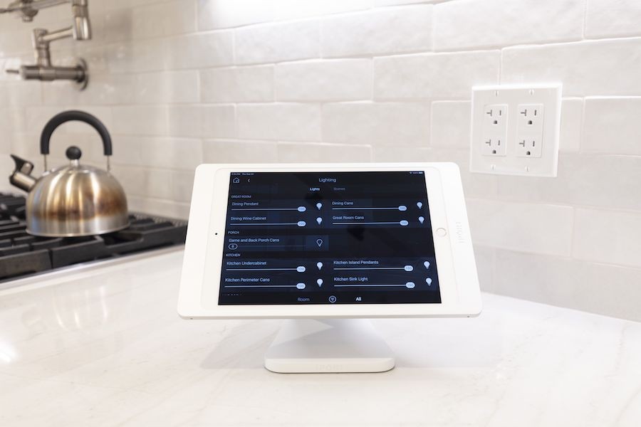 Control4 touchscreen in luxurious kitchen.