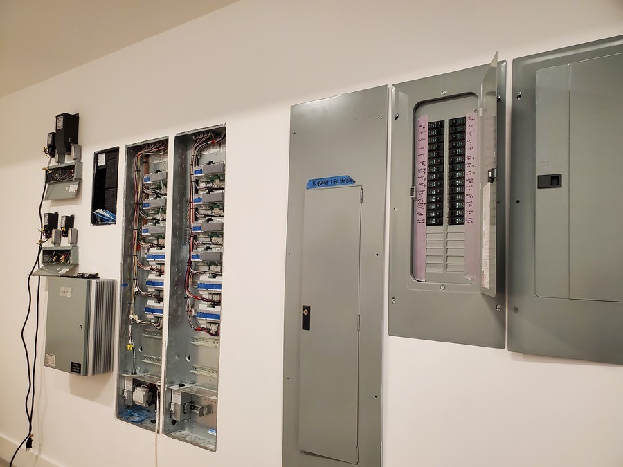 An electric panel installed in a wall.