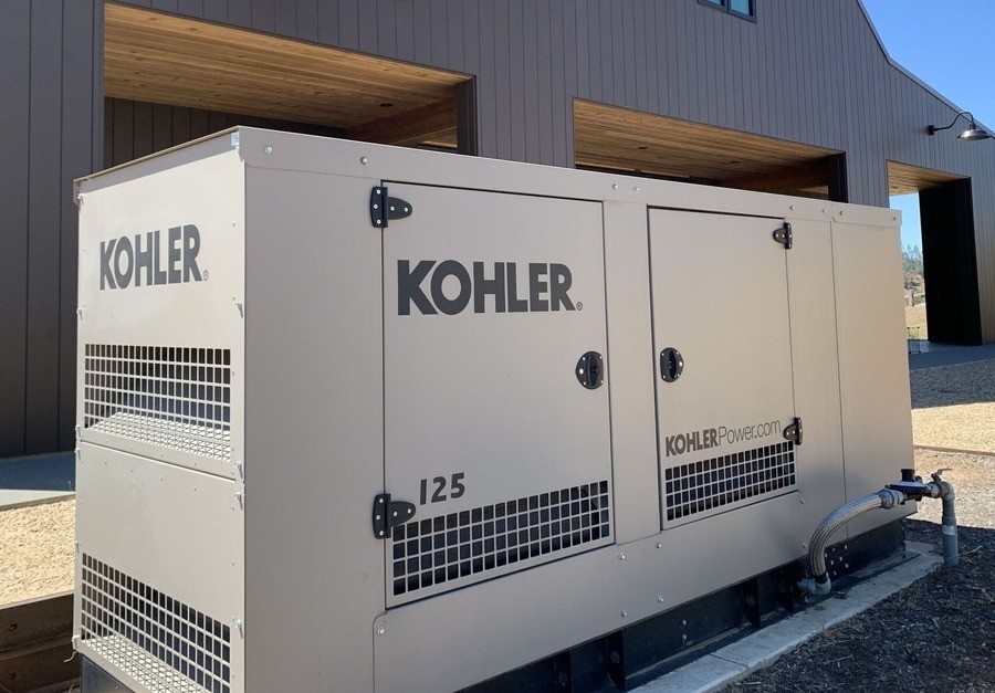 A Kohler generator installed outside of a home.