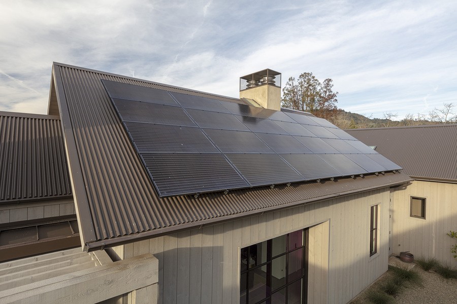 A home with solar panels installed on the roof.