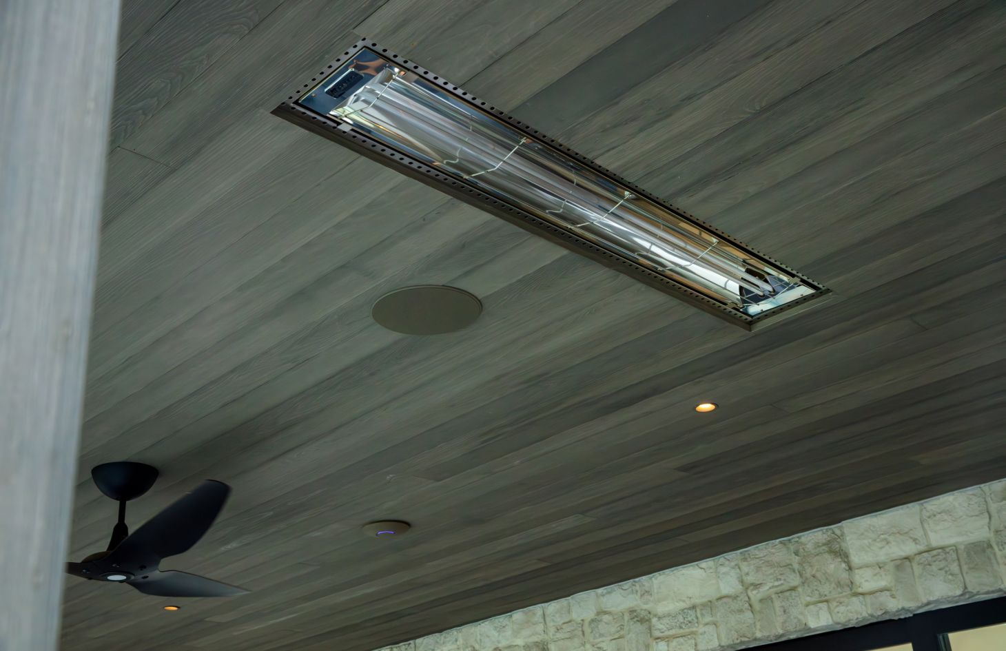 A high-resolution interior image capturing a contemporary space with sleek furnishings, ambient lighting, and a large digital screen that highlights advanced home theater technology.