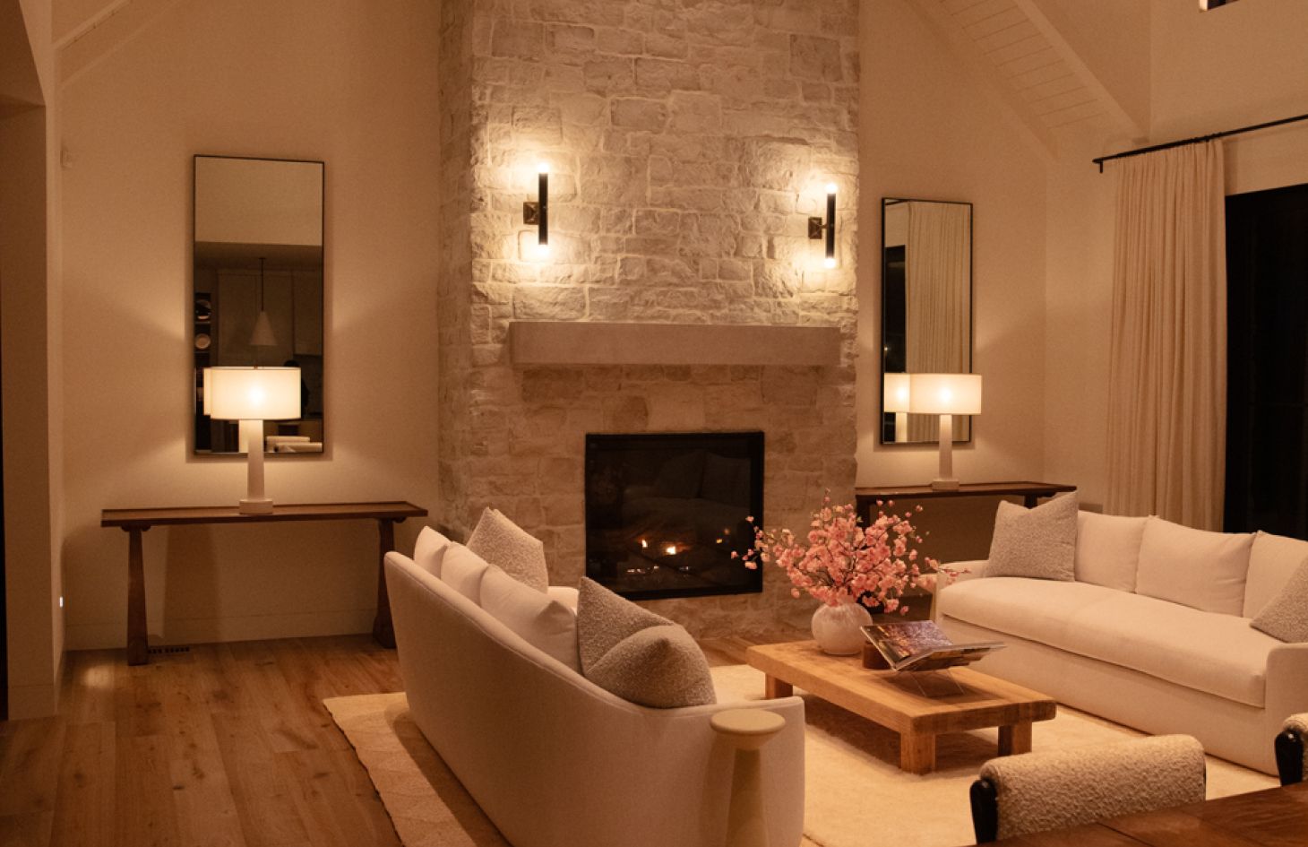 A contemporary bedroom interior showcasing a neatly made bed with crisp linens, stylish bedside tables, and soft ambient lighting that creates a serene atmosphere.