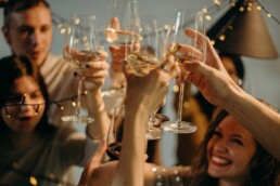A group of people toasting during a holiday celebration.